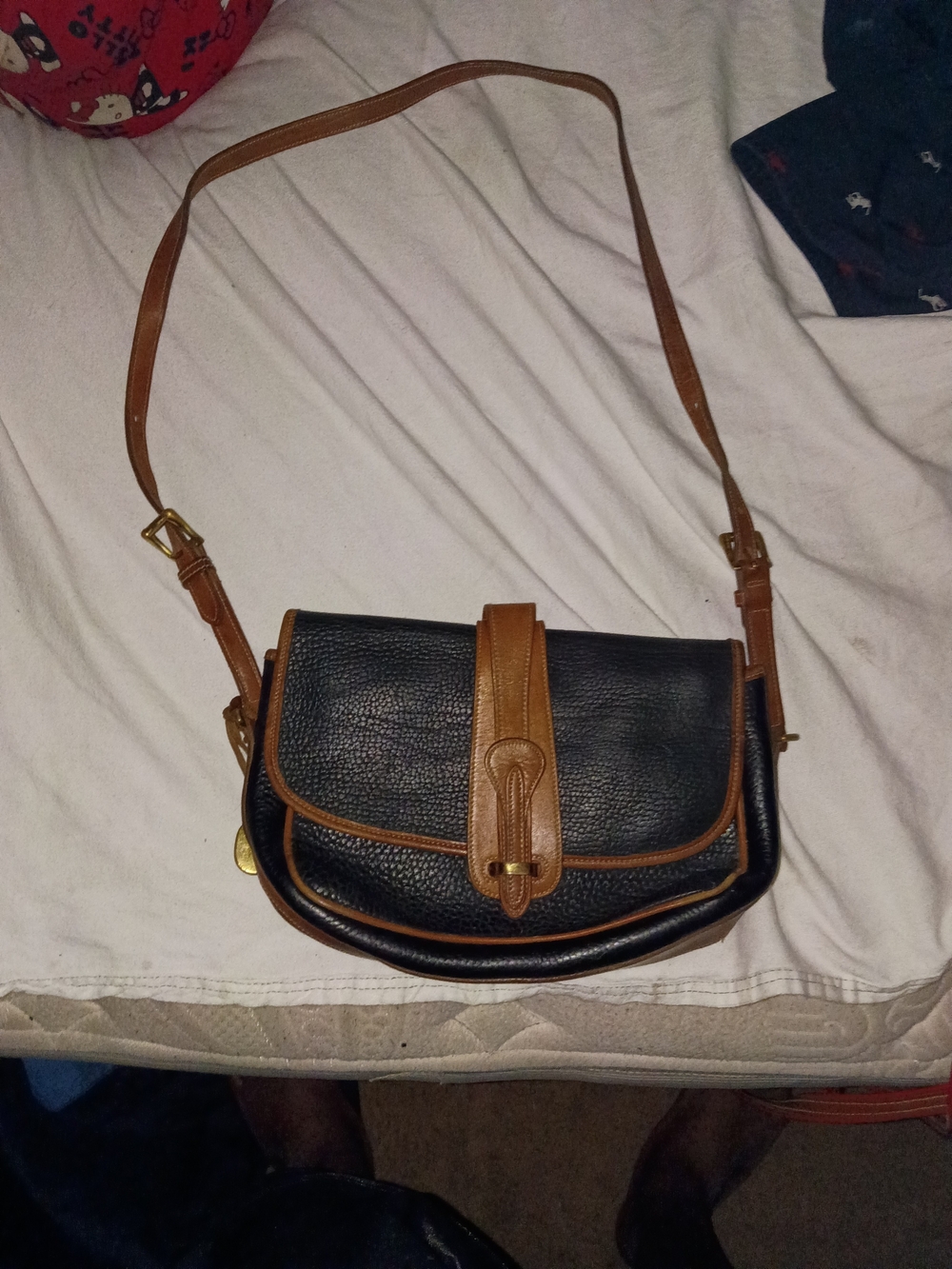 Dooney & Bourke Black with Brown Trim Pebbled Leather Crossbody